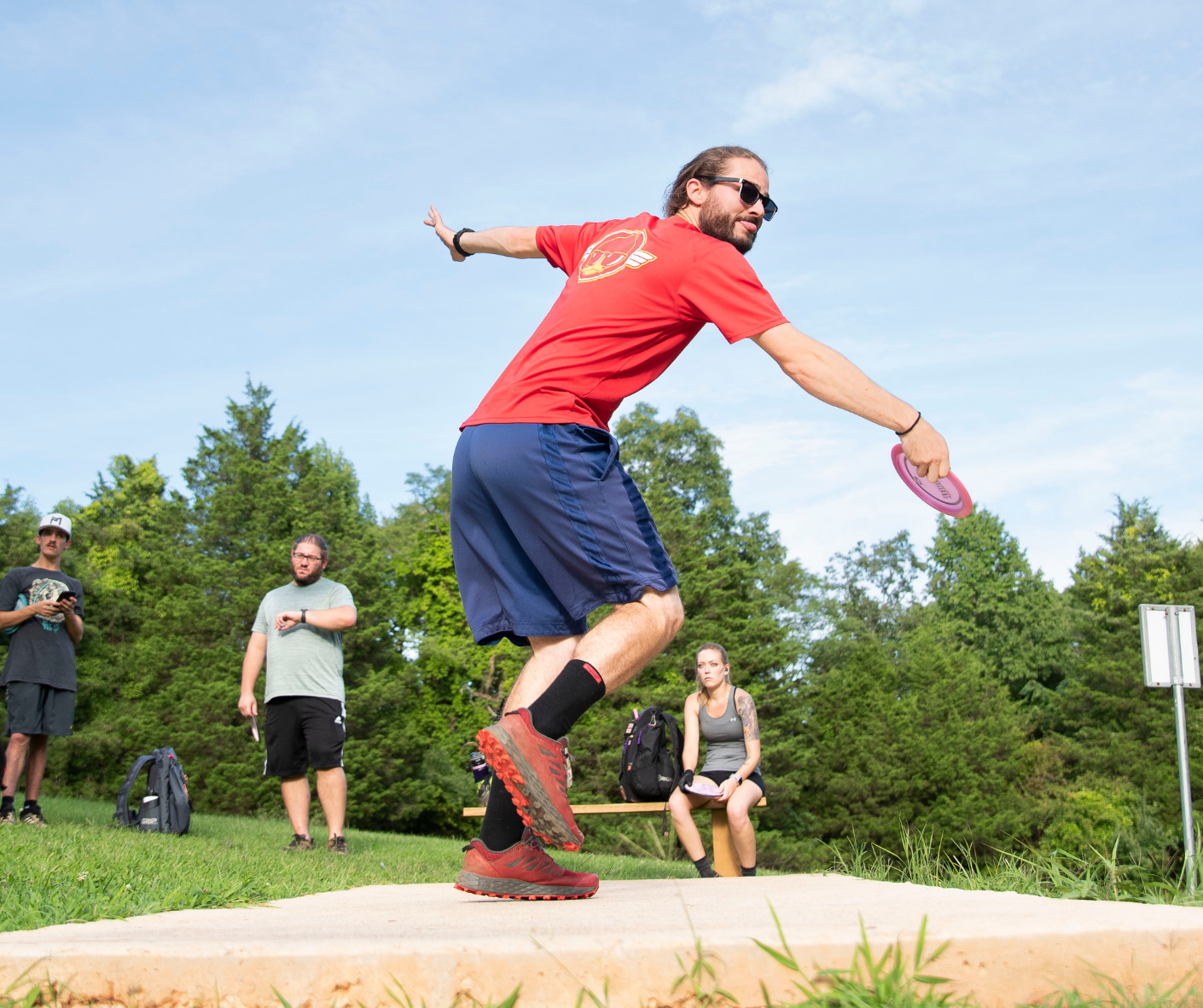 Man playing disc golf at Falling Creek Park